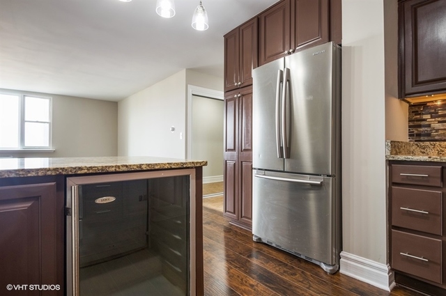6325 North Sheridan Road, Unit 1005 Chicago, IL 60660 - Photo 9 of 24 a metallic refrigerator freezer sitting in a kitchen