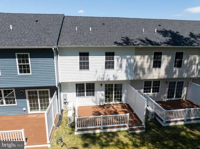 a view of a house with roof deck and barbeque grill