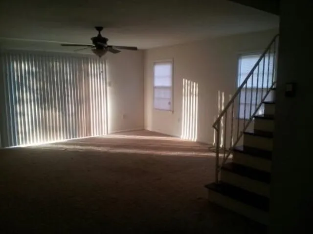 a view of an empty room with stairs