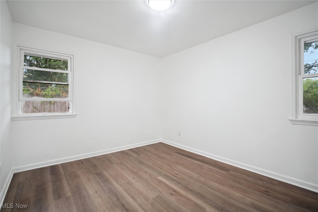 8796 West Ridgewood Drive Cleveland, OH 44130 - Photo 28 of 38 Spare room featuring wood-type flooring and plenty of natural light