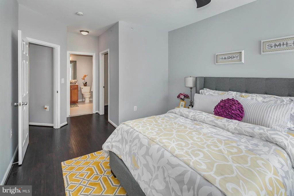 1515 North Point Drive, Unit 304 Reston, VA 20194 - Photo 14 of 23 Master Bed with Ensuite
