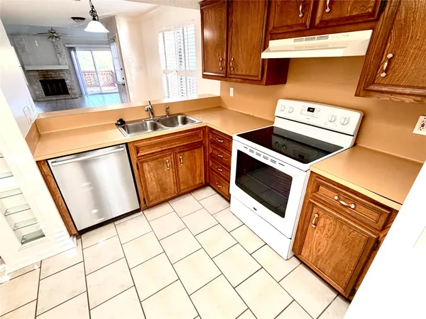 a kitchen with a stove a sink and a microwave