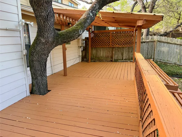 a terrace with outdoor seating and wooden floor