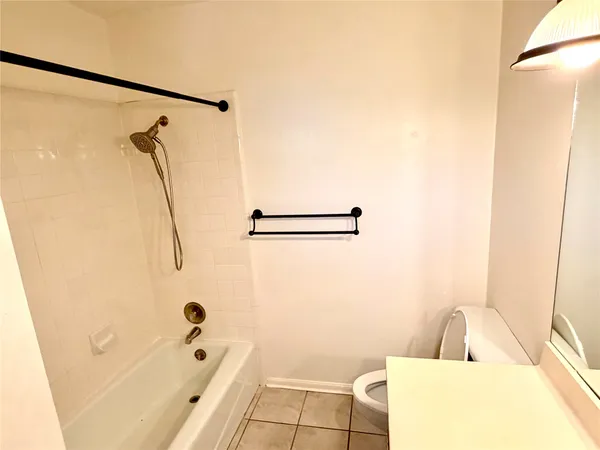 a bathroom with a tub and a shower