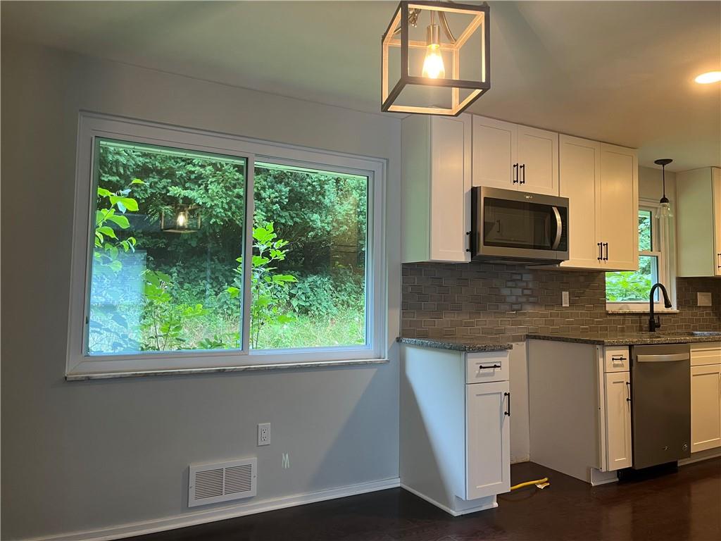345 Thompson Run Road Pittsburgh, PA 15237 - Photo 8 of 25 View of dining room and kitchen