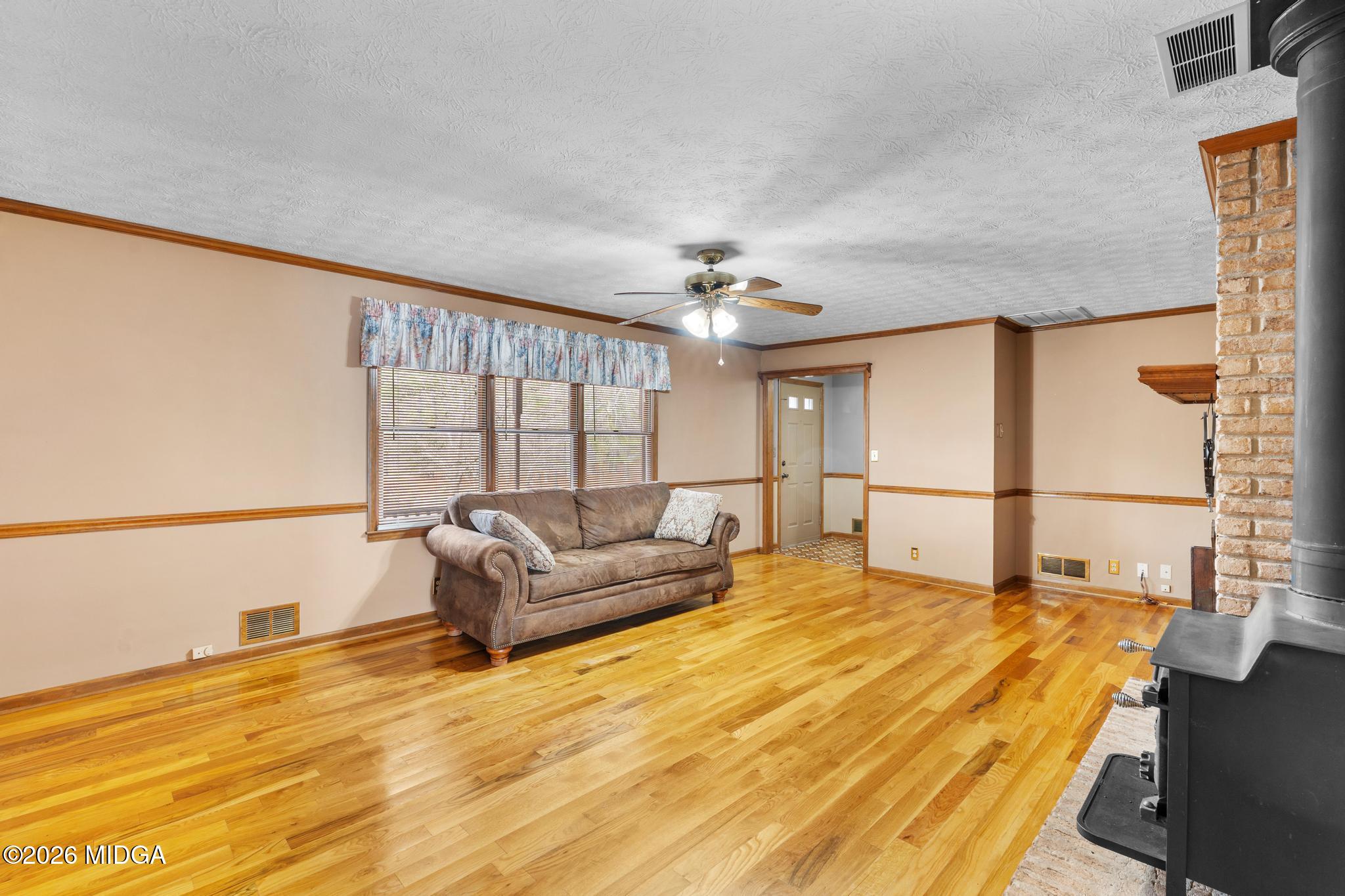 171 Wynn Drive Hampton, GA 30228 - Photo 37 of 64 a spacious bedroom with a bed and a large window