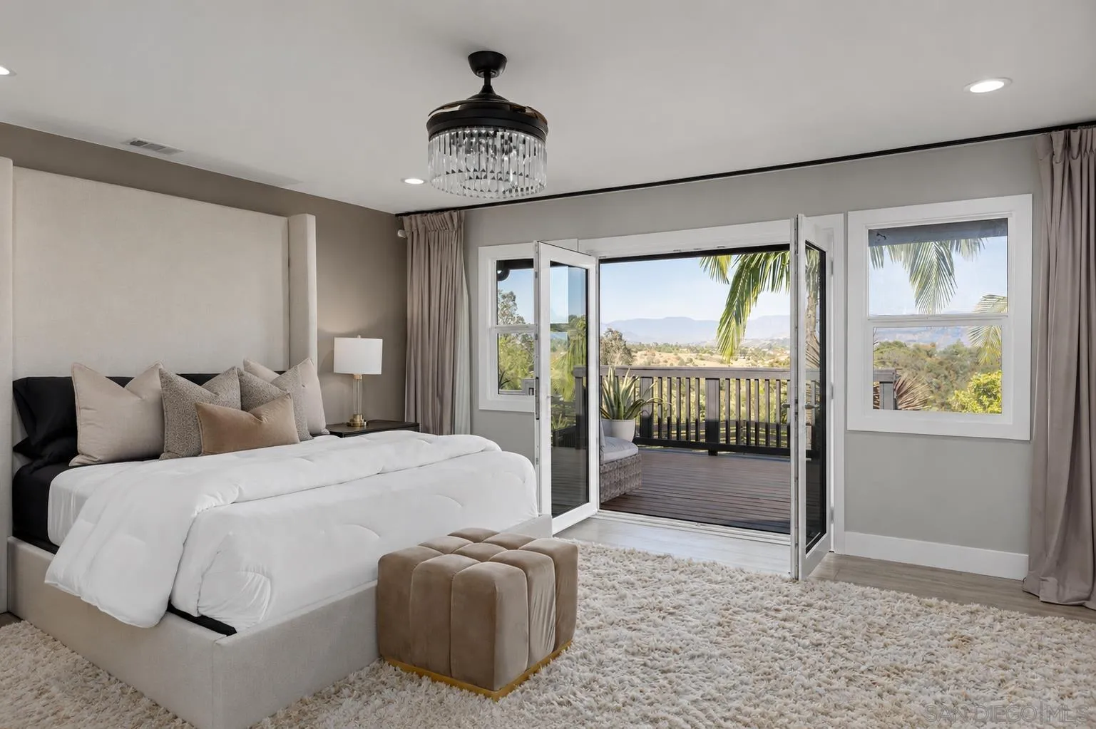 521 Rancho Camino Fallbrook, CA 92028 - Photo 26 of 72 a bedroom with a large bed and a large window