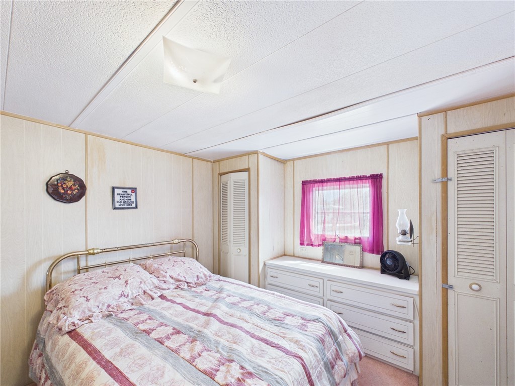 6135 98th Lane Sebastian, FL 32958 - Photo 16 of 18 a bedroom with a bed and a window