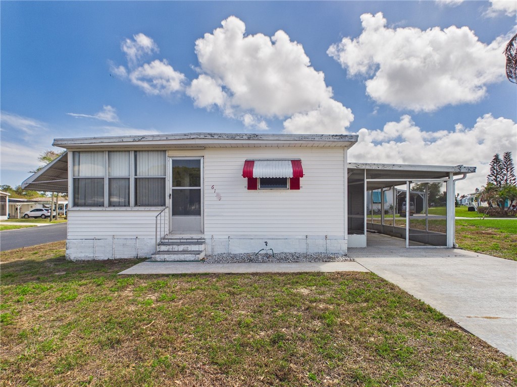 6135 98th Lane Sebastian, FL 32958 - Photo 2 of 18 a view of a house with backyard and porch