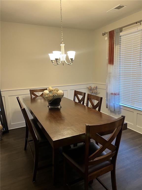 270 Wellbrook Drive Covington, GA 30016 - Photo 4 of 11 a view of a dining room with furniture and chandelier