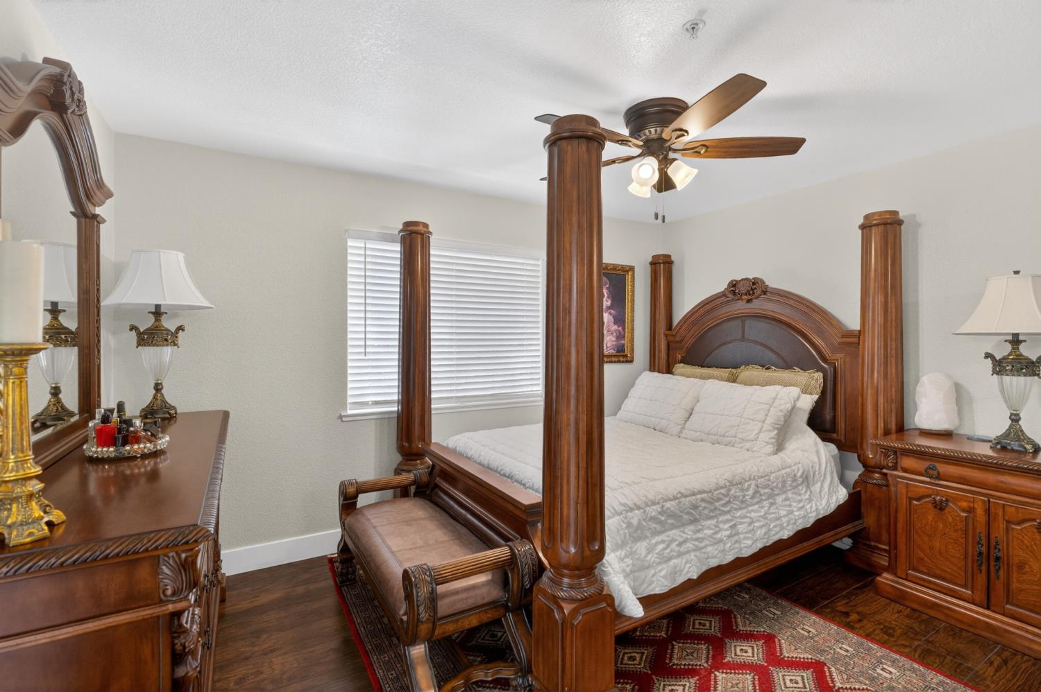 8020 Walerga Road, Unit 1140 Antelope, CA 95843 - Photo 23 of 37 a bedroom with a bed and wooden floor