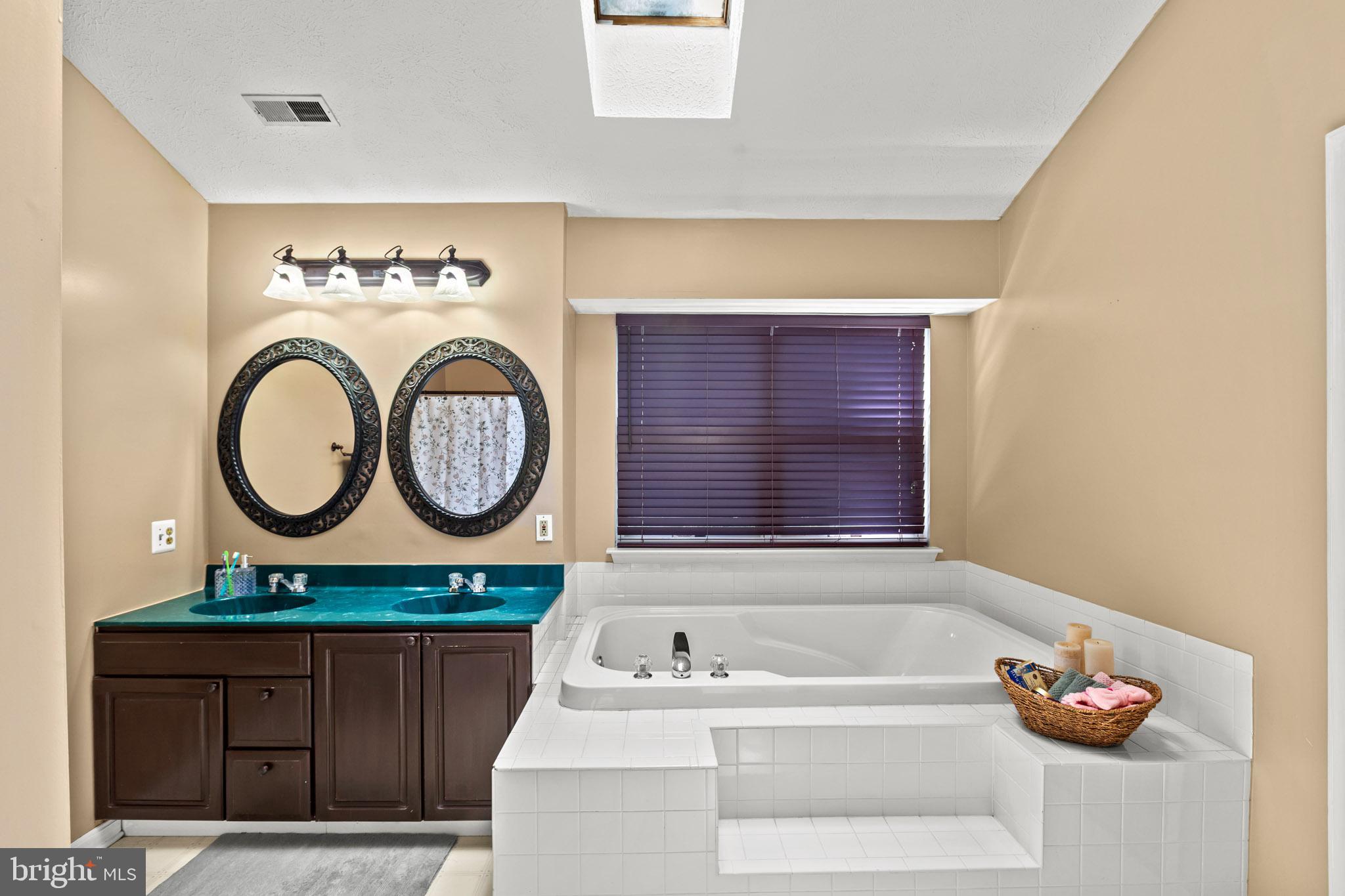 667 San Gabriel Road Lusby, MD 20657 - Photo 18 of 30 Primary en suite with soaking tub and double sinks