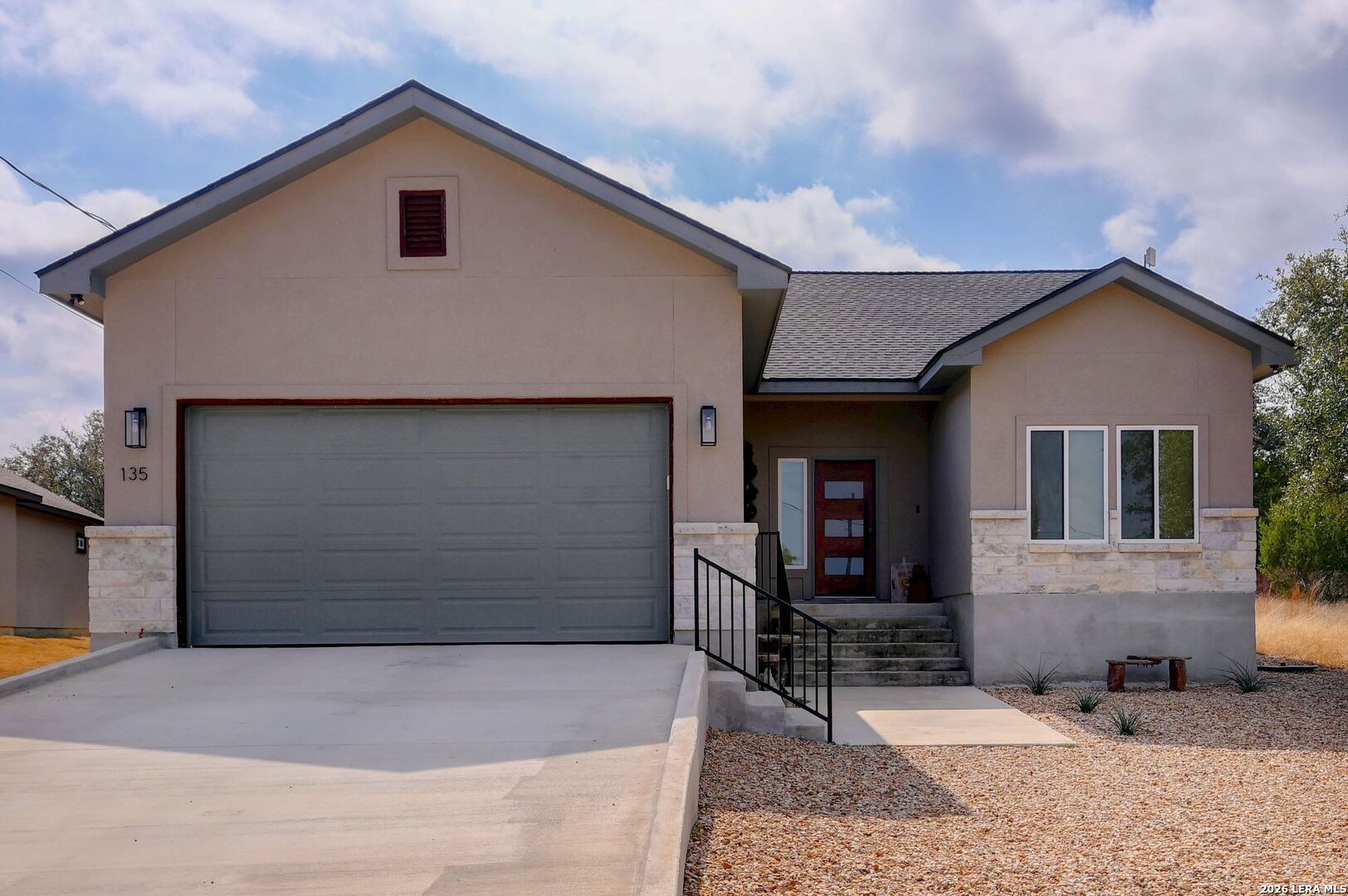 135 West Pat Dolan Blanco, TX 78606 - Photo 1 of 17 a front view of a house with garden