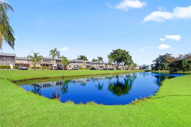 a view of a lake with houses with outdoor space
