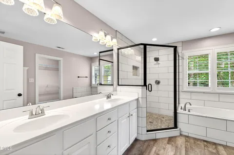 a bathroom with a bath tub and shower