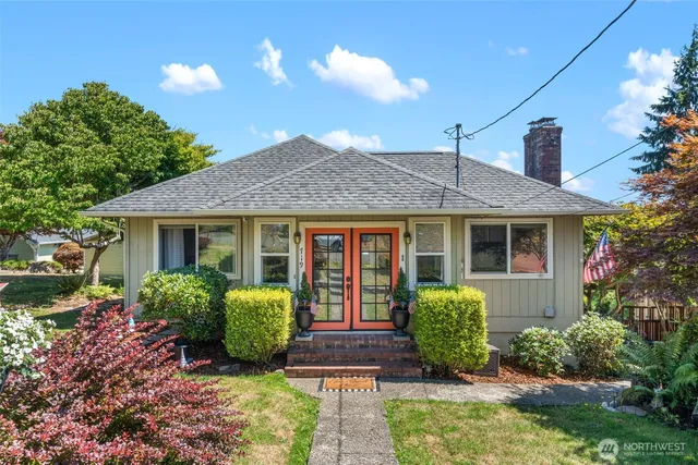 a front view of a house with garden
