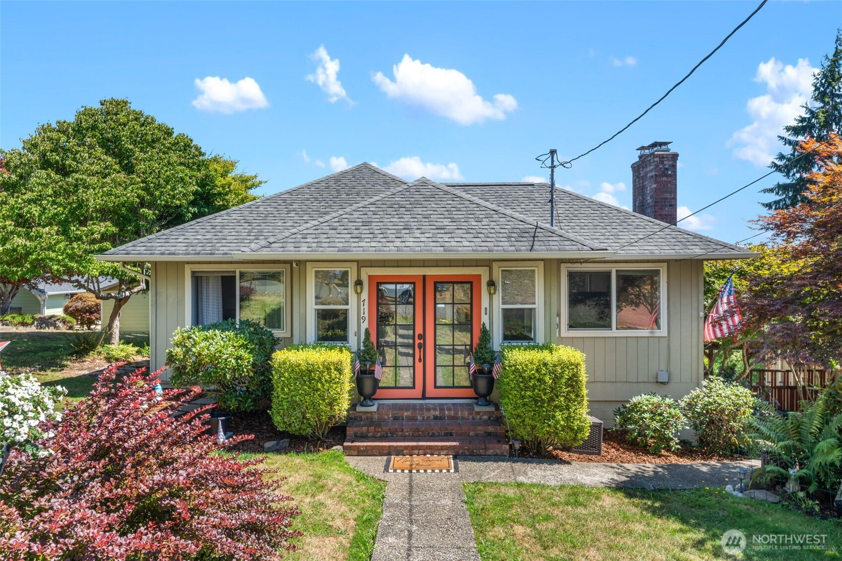 719 Peters Street Raymond, WA 98577 - Photo 1 of 36 a front view of a house with garden