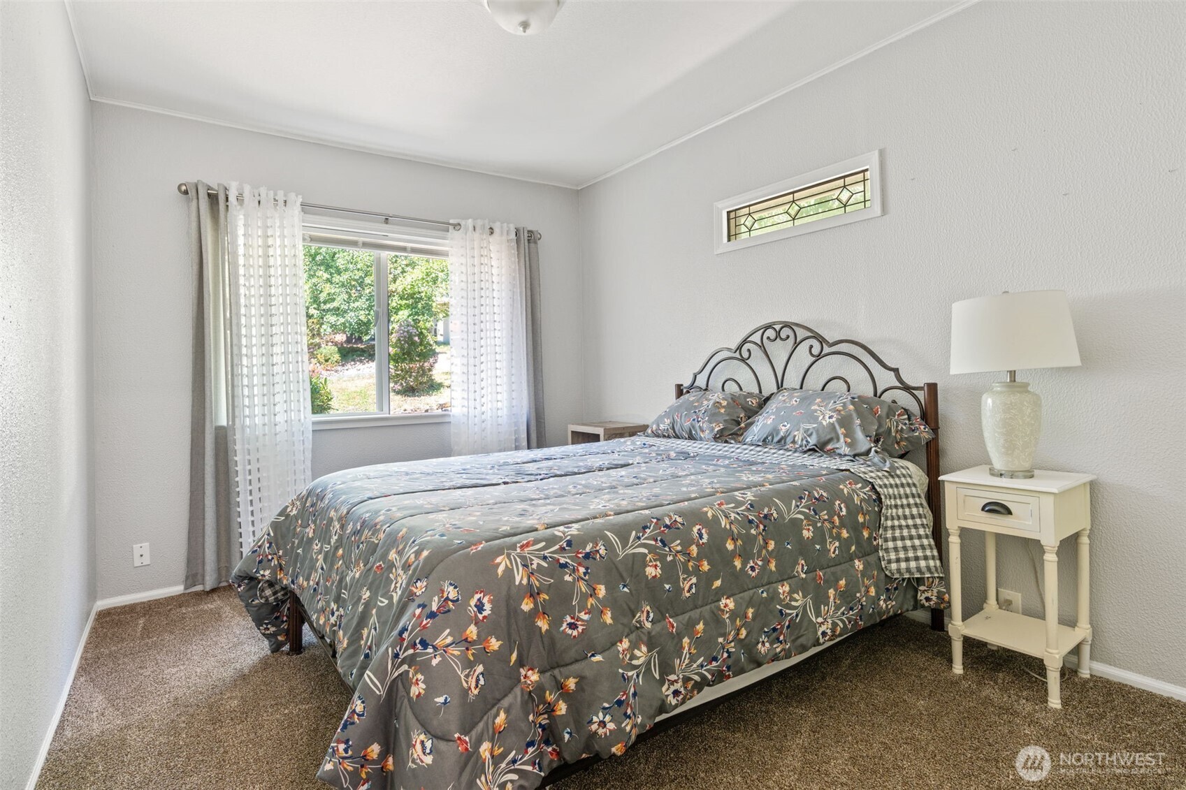 719 Peters Street Raymond, WA 98577 - Photo 13 of 36 a bedroom with a bed and a window