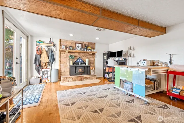 a bed room with a bed and a large window