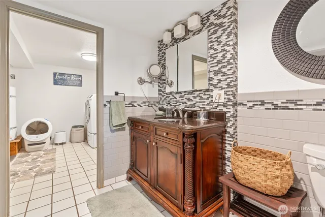a bathroom with a mirror and a sink