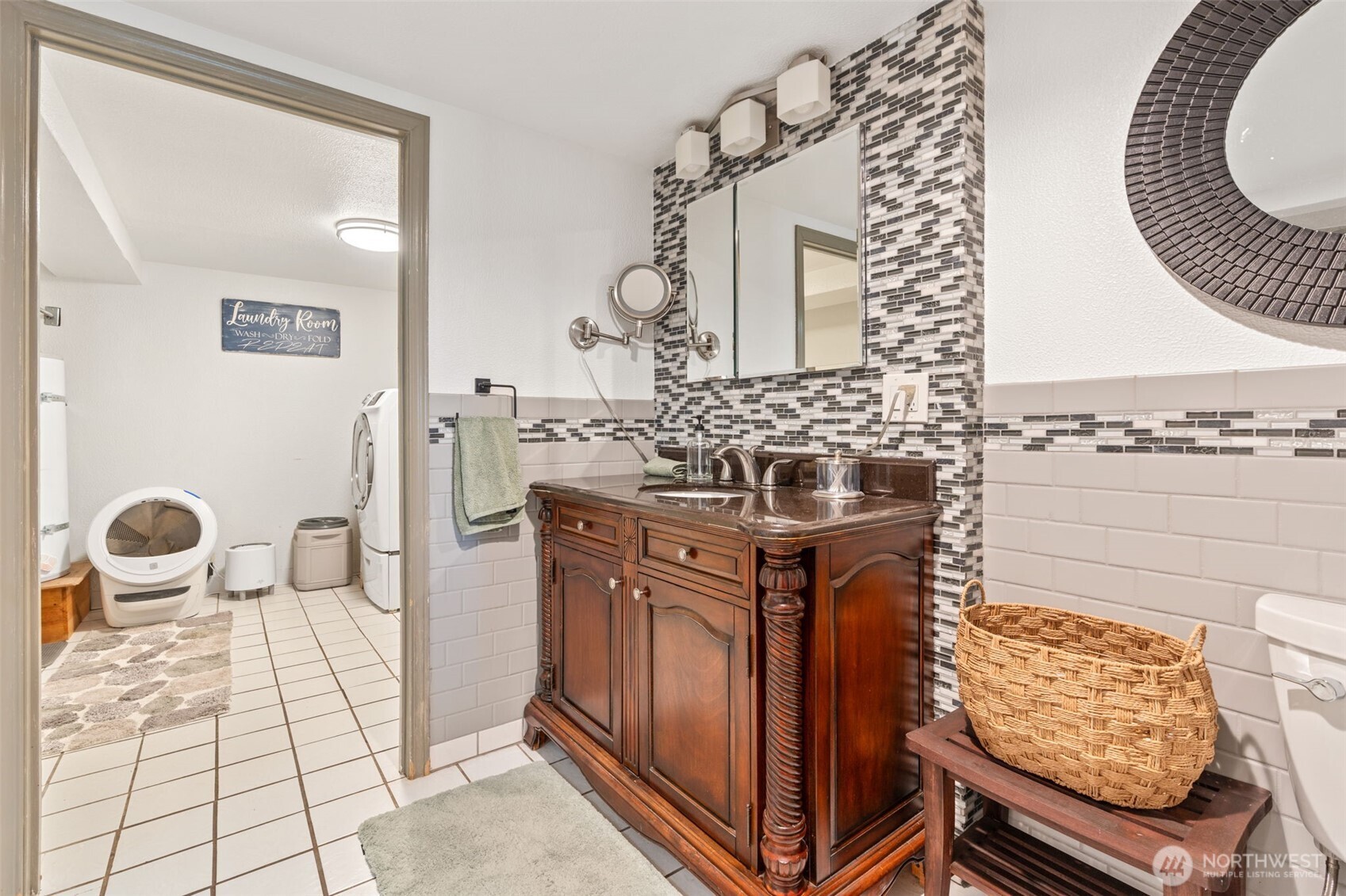 719 Peters Street Raymond, WA 98577 - Photo 21 of 36 a bathroom with a mirror and a sink