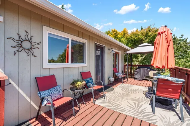 a outdoor space with patio the couches and a potted plant with table and chairs