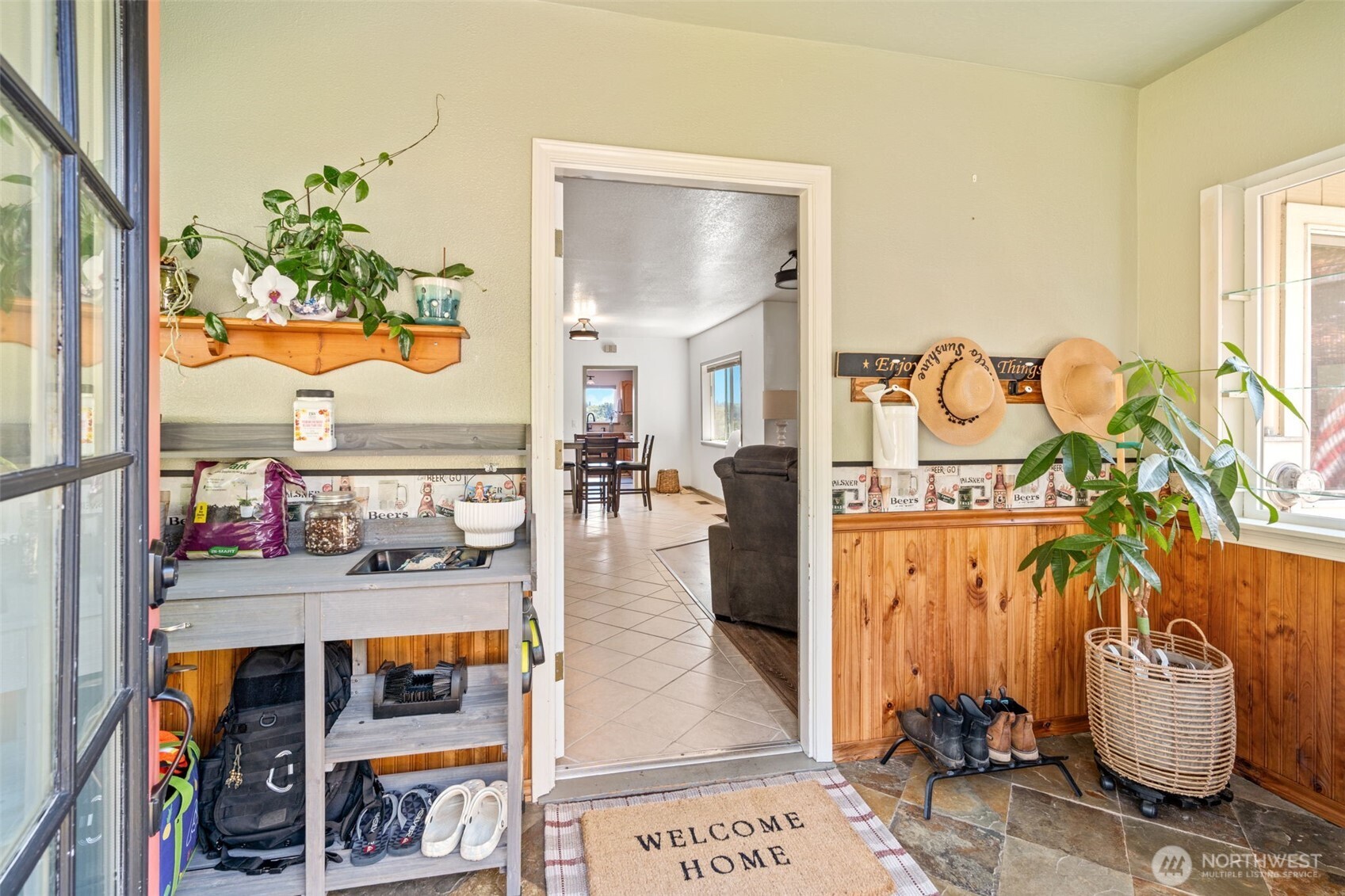 719 Peters Street Raymond, WA 98577 - Photo 3 of 36 a living room with furniture and a floor to ceiling window