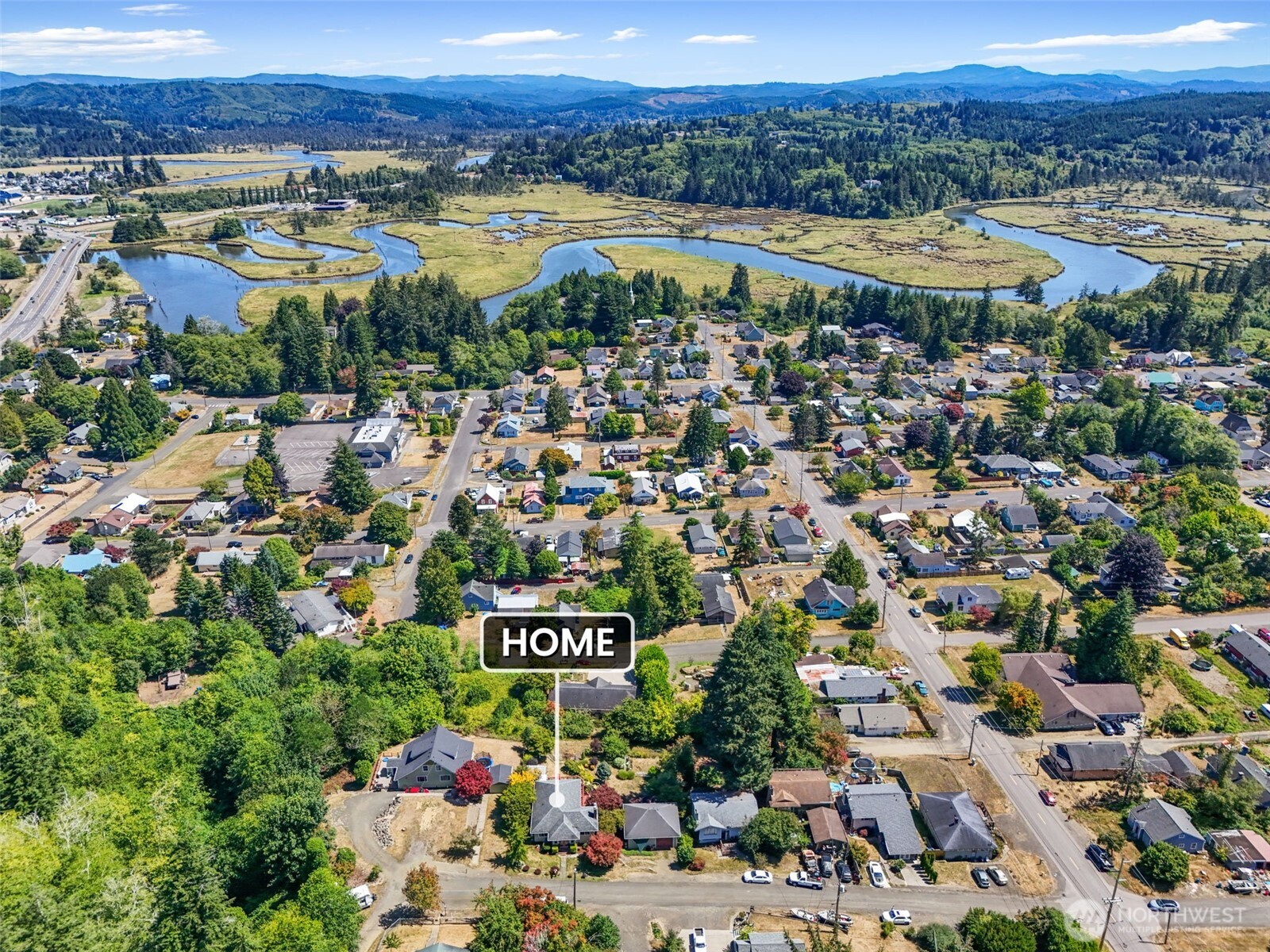 719 Peters Street Raymond, WA 98577 - Photo 35 of 36 a view of a city with mountains in the background