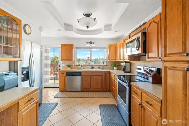 a kitchen with stainless steel appliances granite countertop a stove and a sink