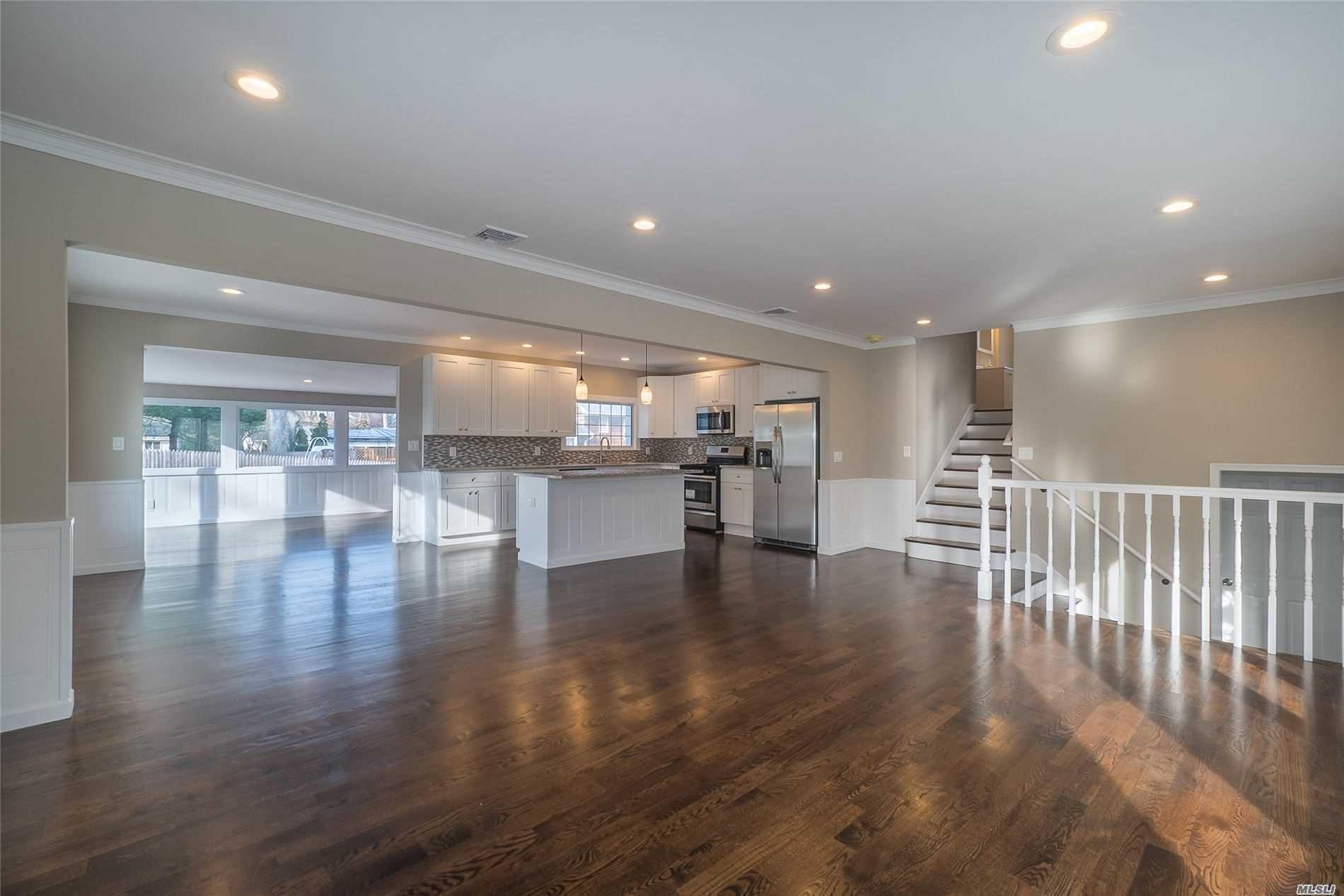 12 Grove Road Kings Park, NY 11754 - Photo 1 of 1 a view of kitchen with a table and chairs