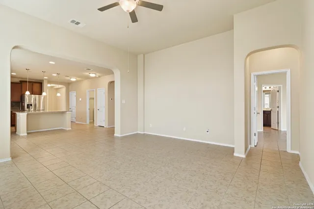 a view of a hallway with a kitchen
