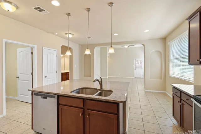 a bathroom with a sink double vanity and a mirror