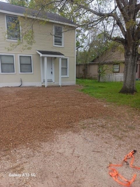 312 South Pumphrey Street Edna, TX 77957 - Photo 1 of 12 front view of a house with a yard