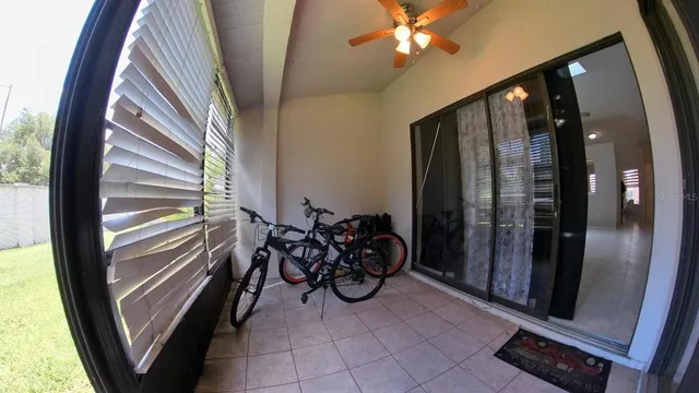 a view of a house with a yard porch and sitting area