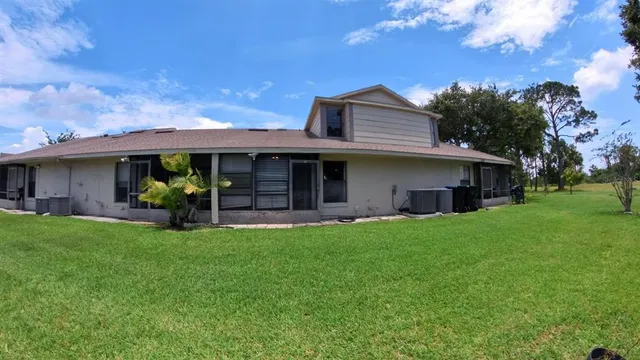 a view of a swimming pool and lounge chair