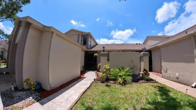 a view of a porch with potted plants