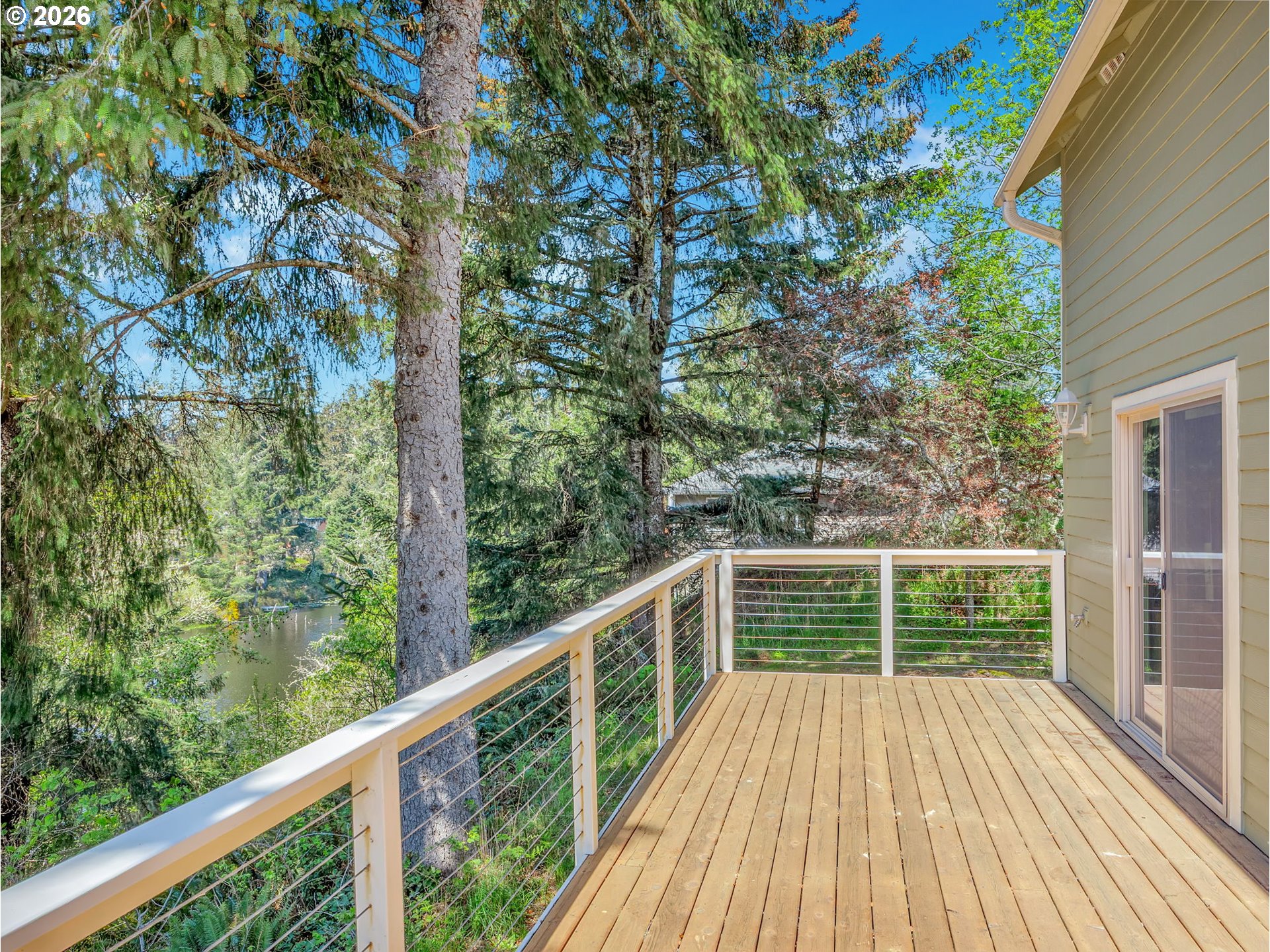 1077 Southwest Ridge Road Warrenton, OR 97146 - Photo 13 of 46 a view of balcony with trees