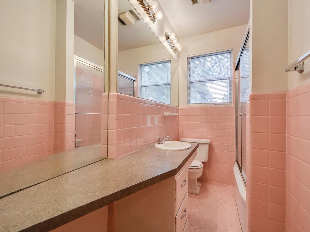 2819 San Gabriel Street, Unit B Austin, TX 78705 - Photo 15 of 20 a bathroom with a sink a toilet and shower