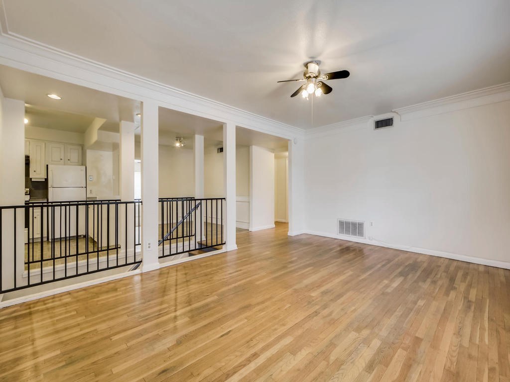 2819 San Gabriel Street, Unit B Austin, TX 78705 - Photo 5 of 20 an empty room with wooden floor fan and windows
