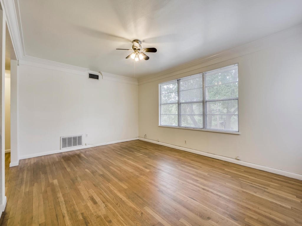 2819 San Gabriel Street, Unit B Austin, TX 78705 - Photo 6 of 20 wooden floor in an empty room with a window