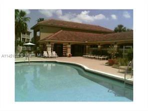 430 South Park Road, Unit 3302 Hollywood, FL 33021 - Photo 28 of 31 a view of a swimming pool with an outdoor seating