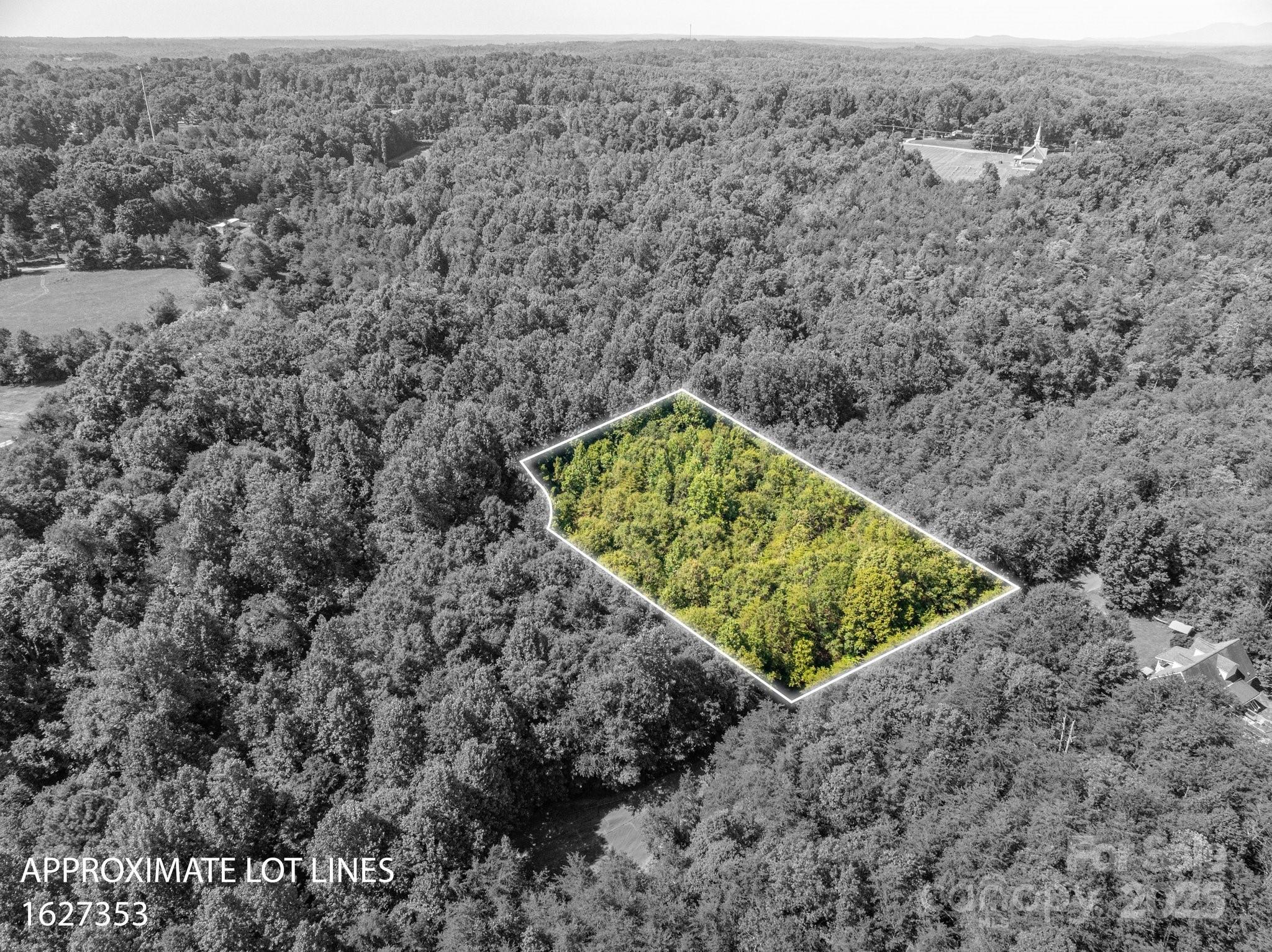 Lot # Meadow Crossing Drive Rutherfordton, NC 28139 - Photo 4 of 13 a view of a dry yard with wooden fence