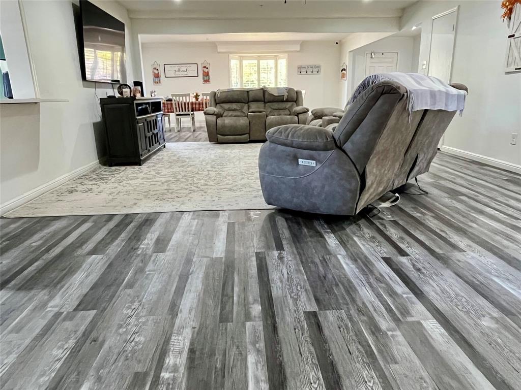 5302 Vale Street Greenville, TX 75402 - Photo 11 of 33 a living room with furniture and a wooden floor