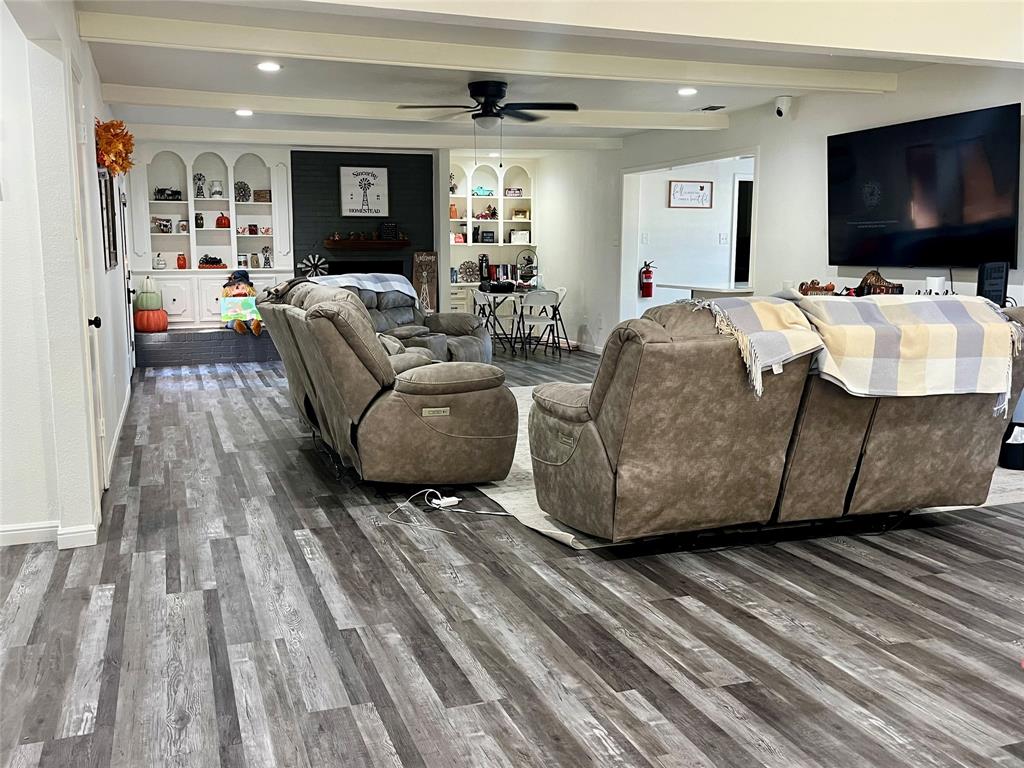 5302 Vale Street Greenville, TX 75402 - Photo 13 of 33 a living room with furniture and a flat screen tv