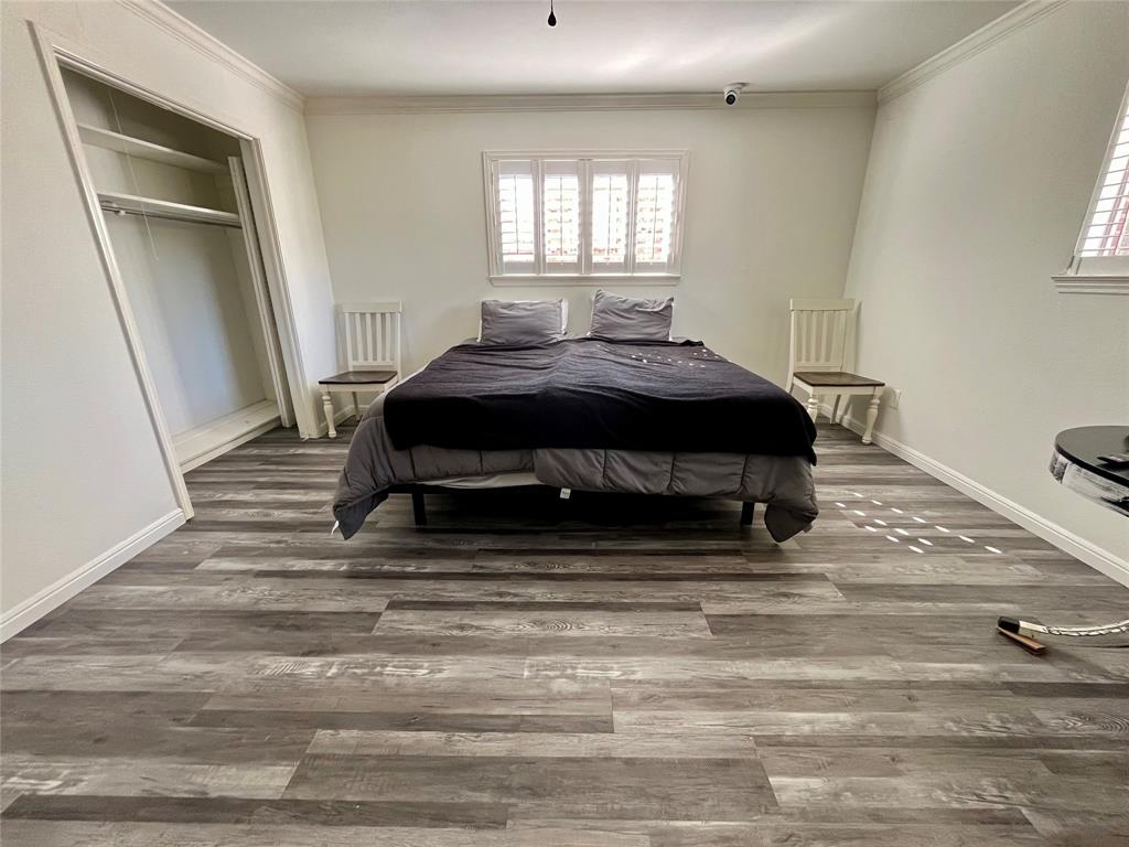 5302 Vale Street Greenville, TX 75402 - Photo 20 of 33 a bedroom with a bed and a window