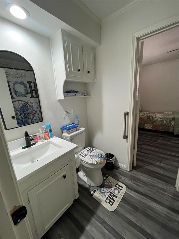 5302 Vale Street Greenville, TX 75402 - Photo 28 of 33 a bathroom with a sink toilet and shower