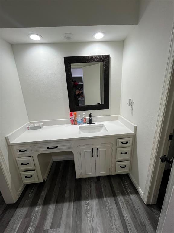 5302 Vale Street Greenville, TX 75402 - Photo 31 of 33 a bathroom with a double vanity sink and mirror