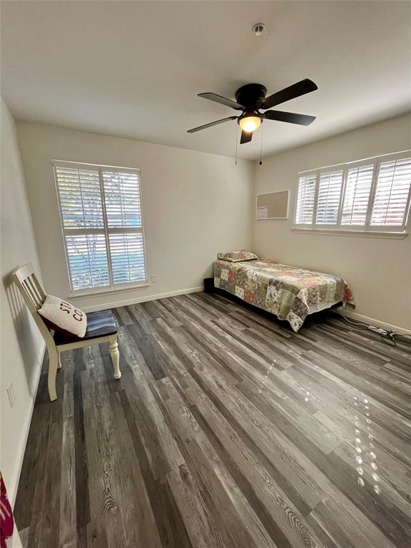 5302 Vale Street Greenville, TX 75402 - Photo 32 of 33 a spacious bedroom with a bed and a window