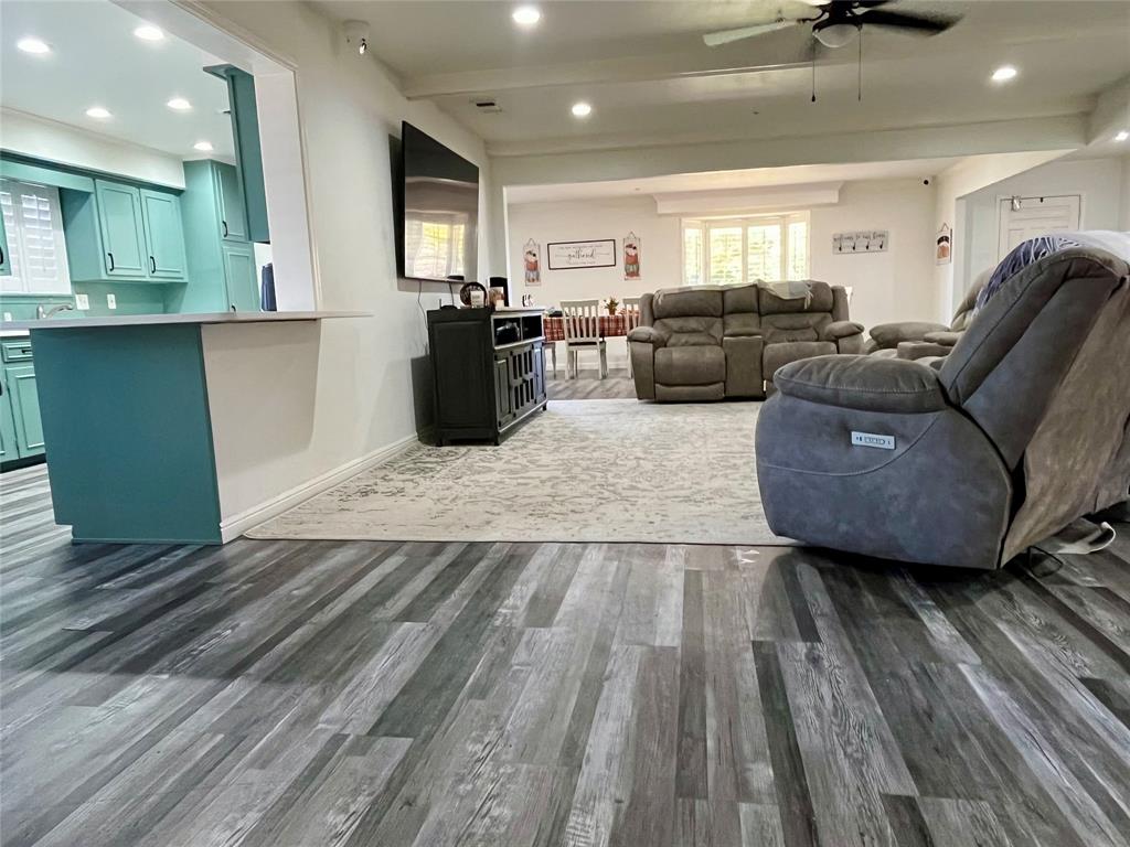 5302 Vale Street Greenville, TX 75402 - Photo 10 of 33 a living room with furniture and a wooden floor