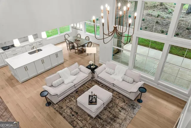 a view of a hallway with wooden floor and a hallway